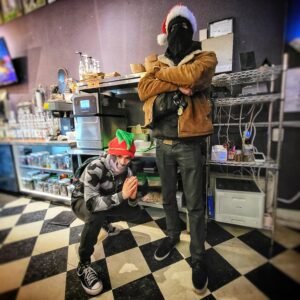guest squatting beside on standing and posing in our main level kitchen